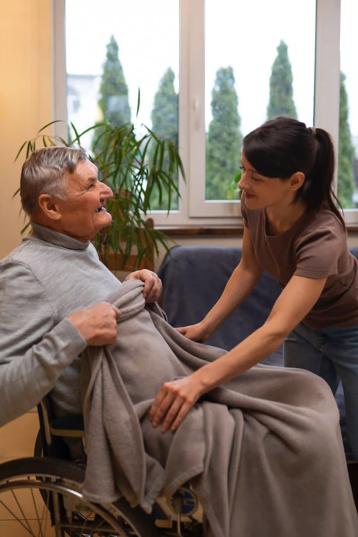 elderly-person-being-taken-care-by-female-caretaker